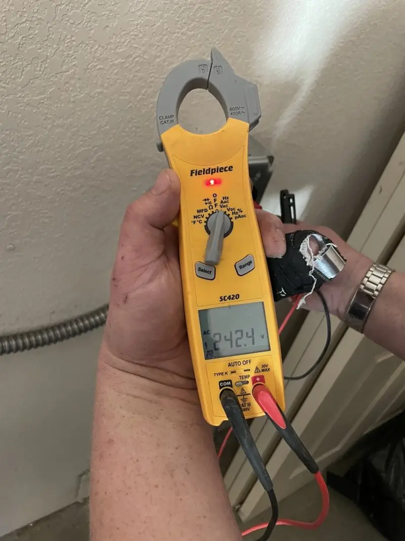 Voltage testing with clamp meter during Generator Installation in Onalaska